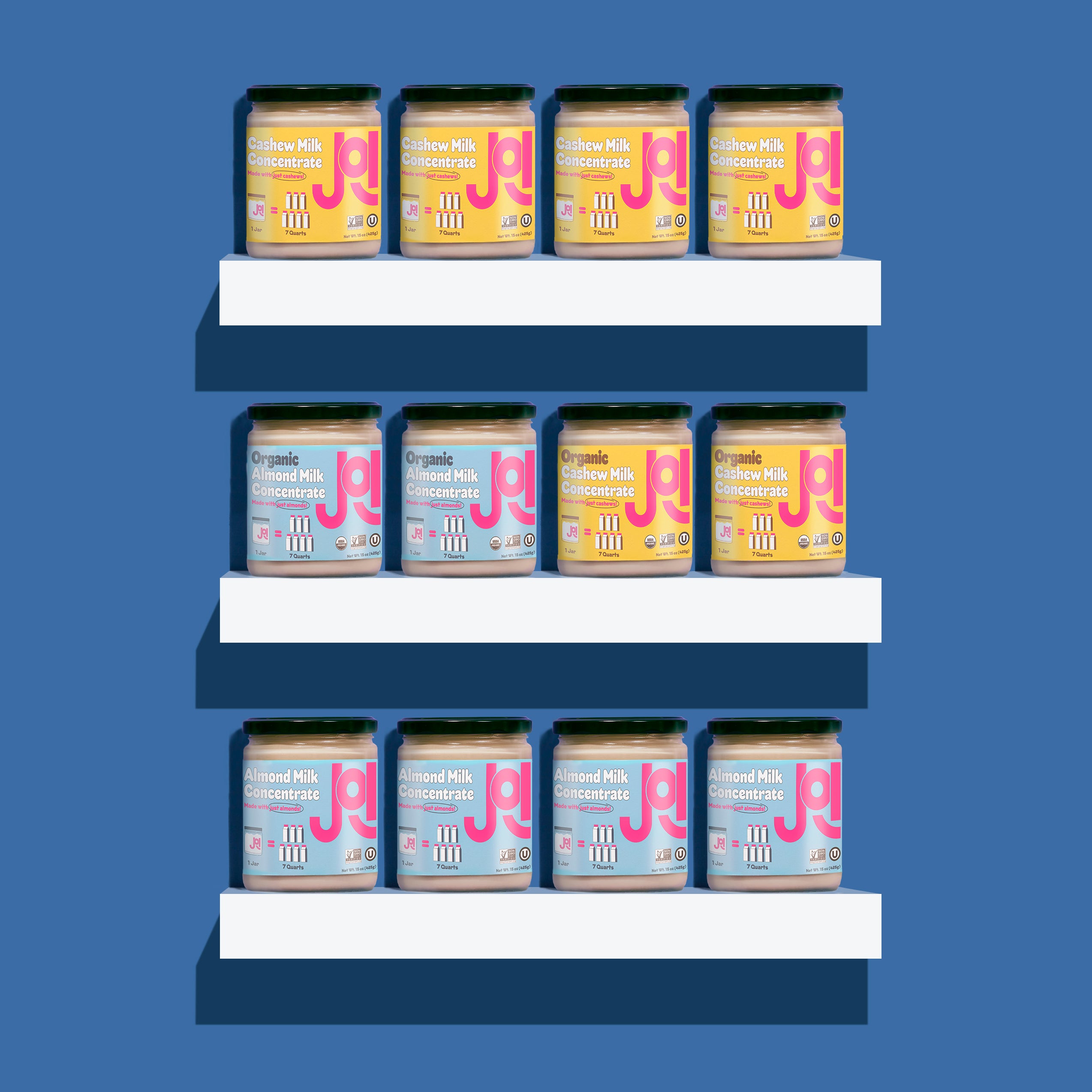 3 white shelves on a solid blue background,  each shelf contains jar of JOI almond and cashew concentrates.