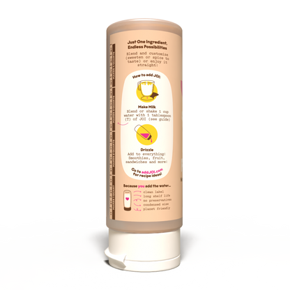A single squeeze bottle of Endless Possibilities plant-based milk against a plain white background. The bottle is light brown with a white cap and features a detailed instructional label showing how to add water and mix the drink.