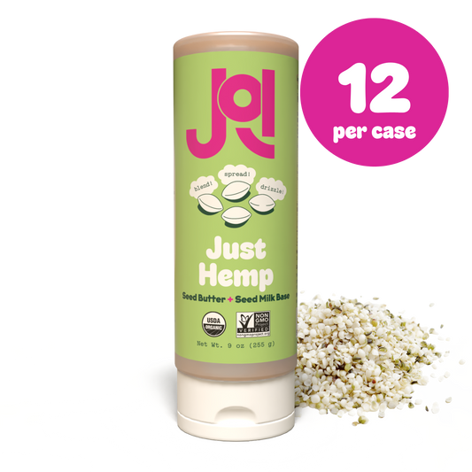 A squeeze tube of Just Hemp seed butter on a white background with a pink circular badge reading '12 per case' and a small pile of hemp seeds beside it.
